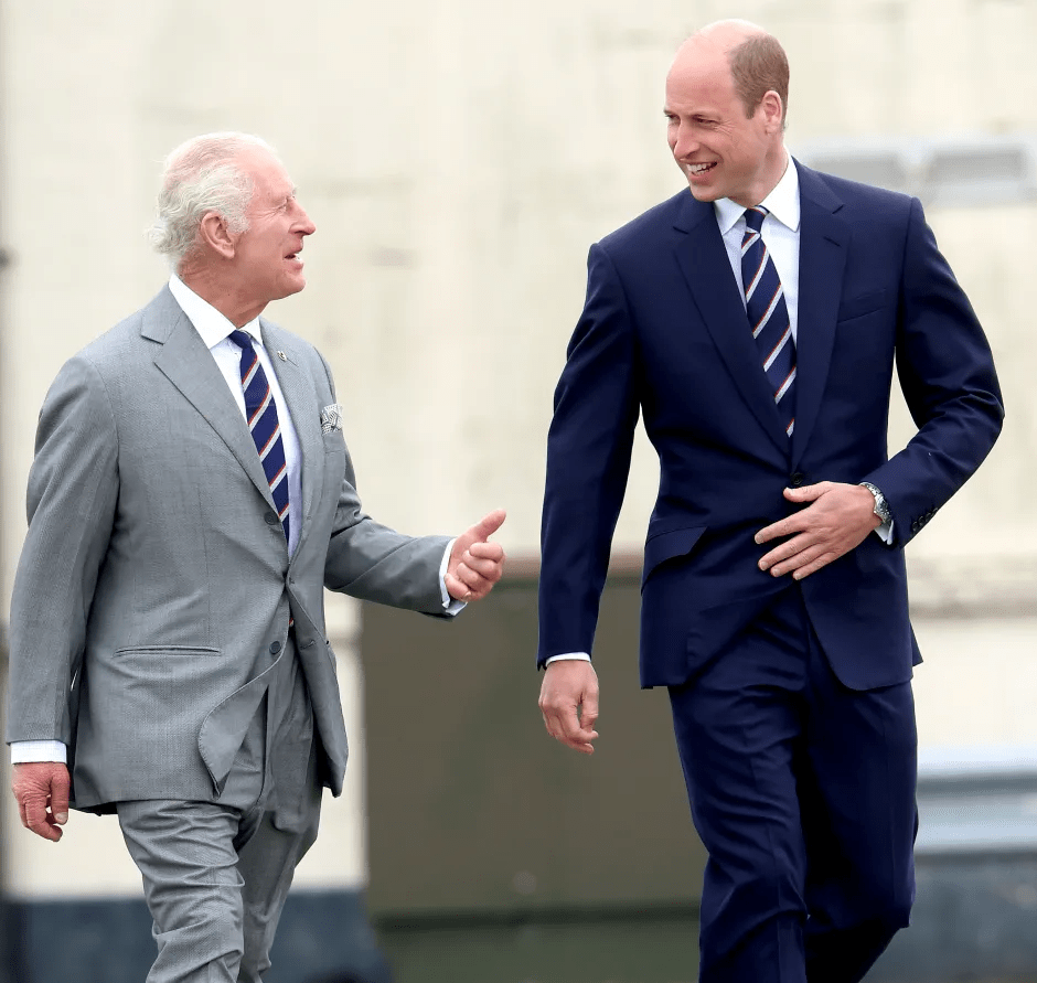King Charles III and Prince William walking and talking.