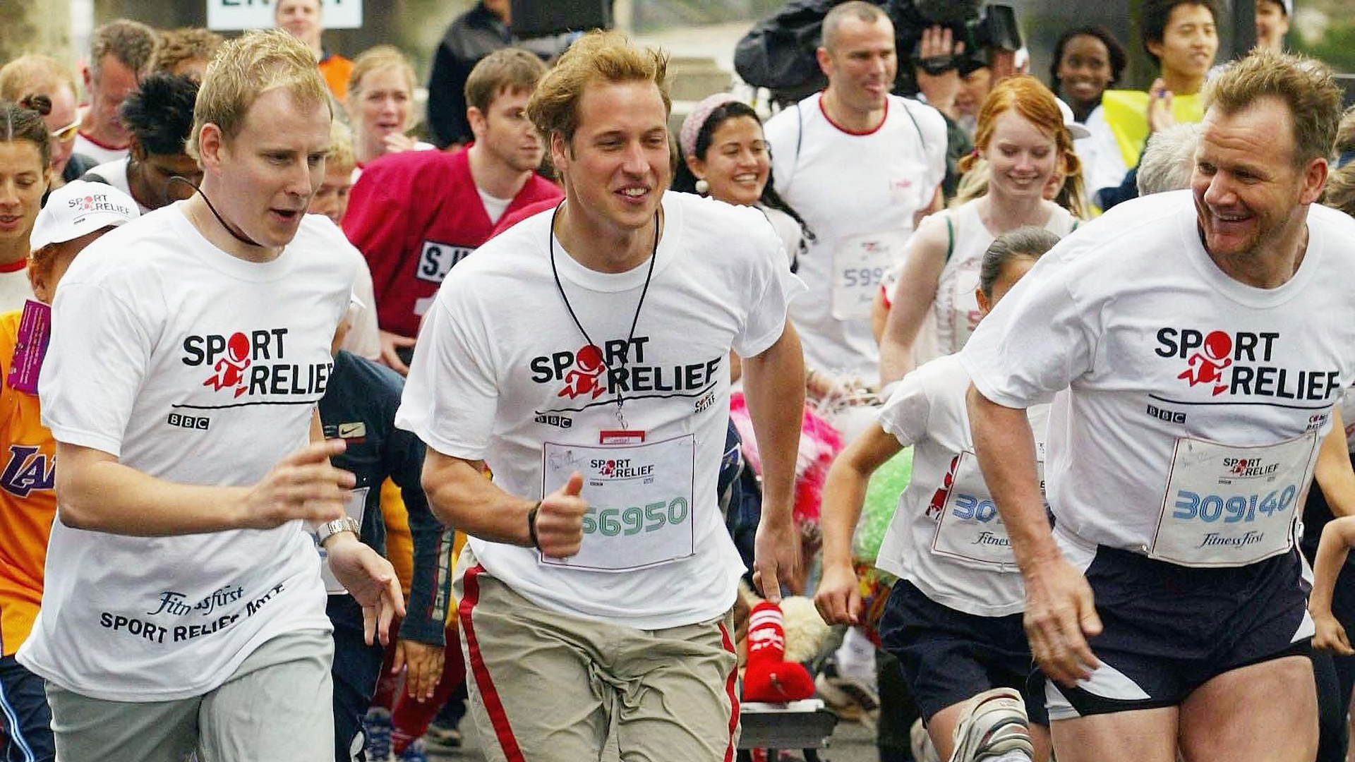 Prince William is seen running the Sport Relief London Mile alongside celebrity chef Gordon Ramsay (R) and with TV presenter Patrick Kielty (L), which he completed in 6 minutes and 10 seconds in 2004