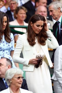 LONDON, ENGLAND - JULY 08:  Catherine, Duchess of Cambridge and Pippa Middleton sit in the Royal Box during the Gentlemen's Singles final match between Roger Federer of Switzerland and Andy Murray of Great Britain on day thirteen of the Wimbledon Lawn Tennis Championships at the All England Lawn Tennis and Croquet Club on July 8, 2012 in London, England.  (Photo by Clive Brunskill/Getty Images)