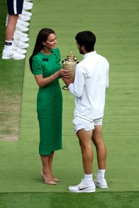 LONDON, ENGLAND - JULY 16: Carlos Alcaraz of Spain recieves the Men's Singles Trophy from Catherine, Princess of Wales following his victory in the Men's Singles Final against Novak Djokovic of Serbia on day fourteen of The Championships Wimbledon 2023 at All England Lawn Tennis and Croquet Club on July 16, 2023 in London, England. (Photo by Patrick Smith/Getty Images)
