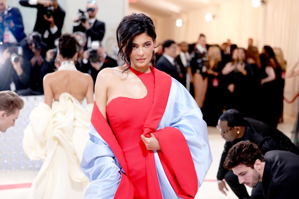 Kylie Jenner at the Met Gala in a red and light blue dress.