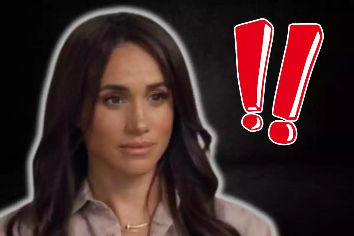 Meghan Markle with dark hair and a serious expression next to two red exclamation marks. Meghan Markle with dark hair and a serious expression next to two red exclamation marks.