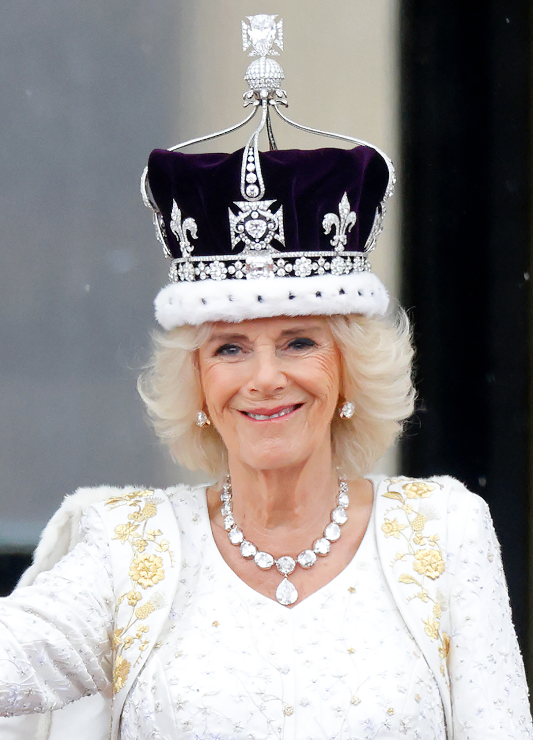 Queen Camilla watches an RAF flypast from the balcony of Buckingham Palace following her and King Charles III's Coronation at Westminster Abbey on May 6, 2023 in London, England