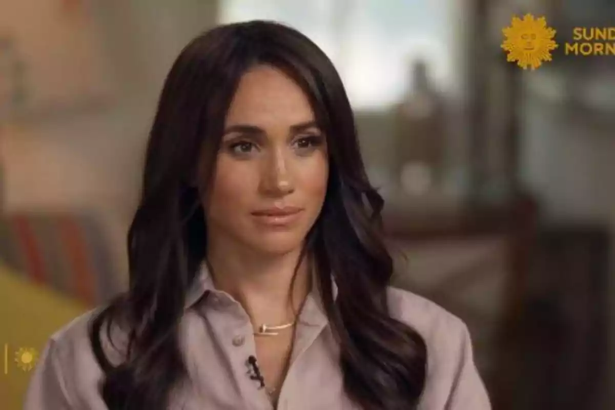 Meghan Markle dressed in a light shirt appears in an interview on a morning television show.