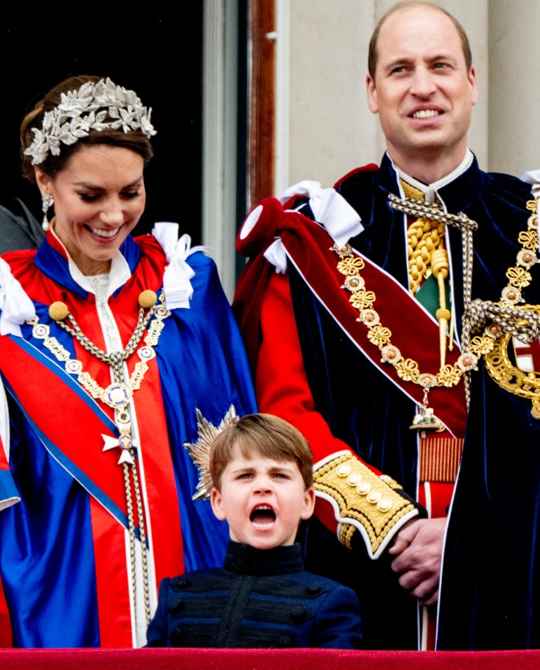 Prince William, Princess Catherine, and Prince Louis on the Buckingham Palace balcony.