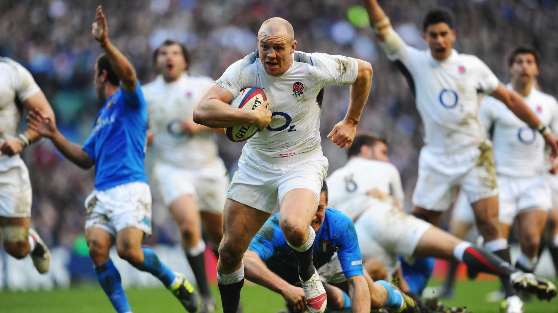 Mike Tindall of England breaks through to score his team's fourth try during the RBS 6 Nations Championship match between England and Italy at Twickenham Stadium on February 12, 2011 in London, England