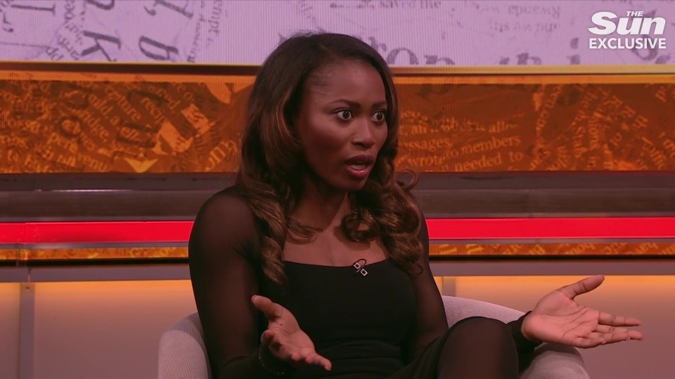 Woman in black top speaking on television.
