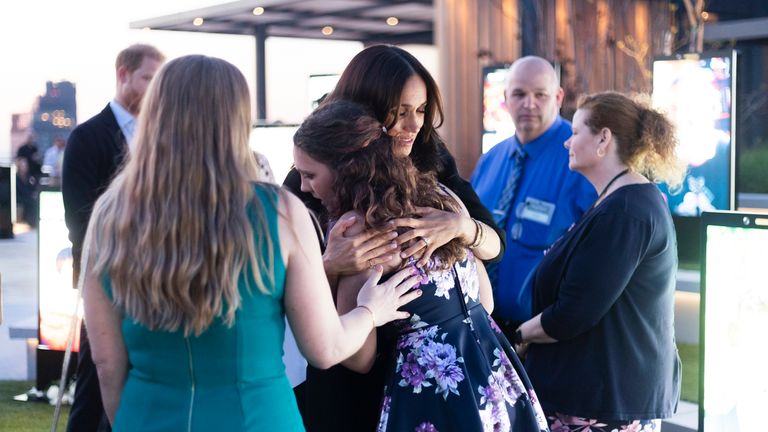 Meghan hugs families at the unveiling of the Lost Screen Memorial in New York. Pic: Emil Cohen for The Archewell Foundation