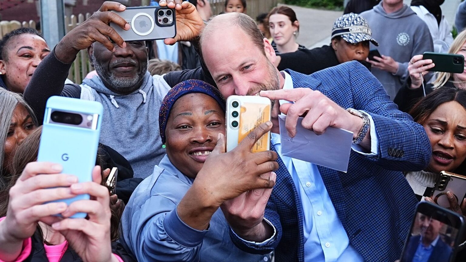Prince William mobbed by selfie-hunters outside youth centre | UK News The Prince of Wales poses for pictures following a visit to the Mentivity community centre and youth hub in Southwark, south London, which helps young people by ensuring they have access to high-quality youth services and safe spaces. The organisation, founded in 2016, engages over 400 local young people weekly through mentoring programmes, school outreach and youth clubs. Picture date: Thursday April 24, 2025.