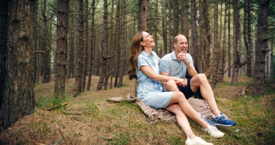 Photo of the Prince and Princess of Wales laughing together in a forest.