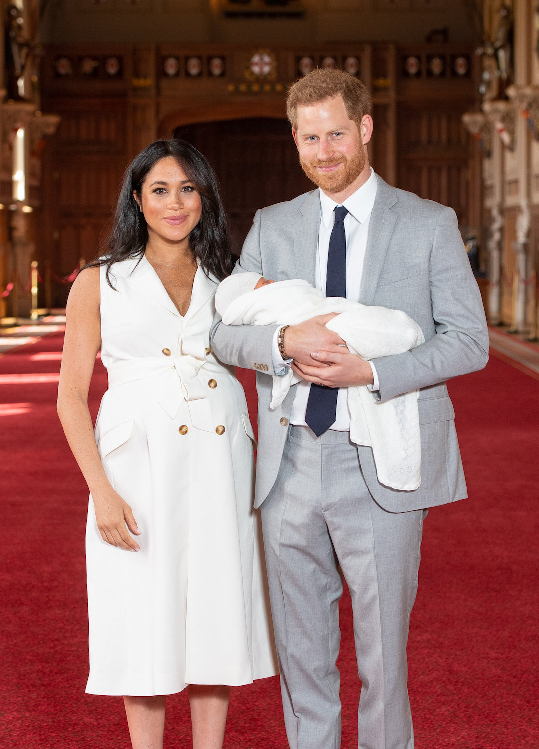 Prince Harry, Duke of Sussex and Meghan, Duchess of Sussex, pose with their newborn son Archie Harrison Mountbatten-Windsor during a photocall in St George's Hall at Windsor Castle on May 8, 2019 in Windsor, England. The Duchess of Sussex gave birth at 05:26 on Monday 06 May, 2019