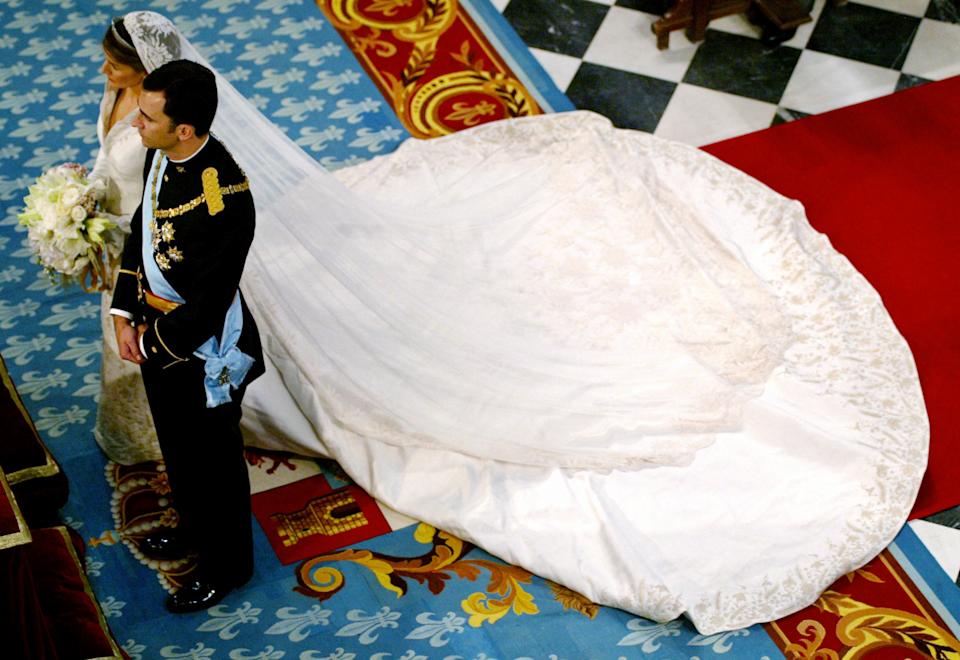 Queen Letizia on her wedding day at the altar with King Felipe