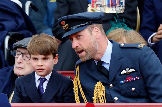 Prince William and his son Prince Louis in formal outfits on the Buckingham Palace balcony during VE DAY 