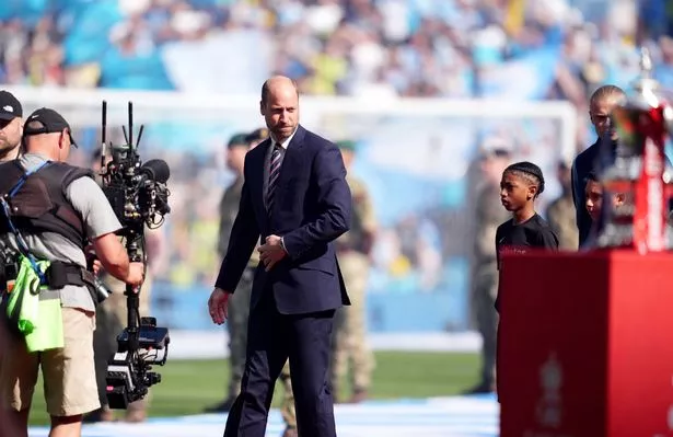 The Prince of Wales after meeting the teams on the pitch before the Emirates FA Cup final 