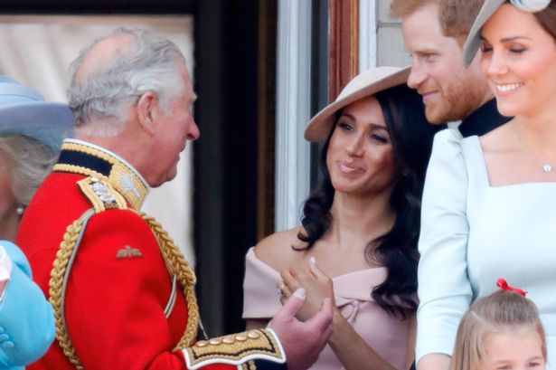 King Charles, Prince Harry, and Meghan, Duchess of Sussex in 2018
