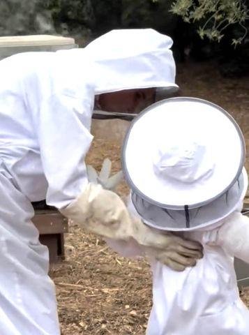 Meghan, Duchess of Sussex/Instagram Meghan Markle and Princess Lilibet in beekeeper suits