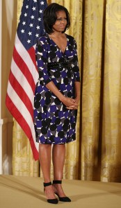 WASHINGTON, DC - NOVEMBER 19:  First lady Michelle Obama stands on stage during an awards ceremony for the President's Committee on the Arts and the Humanities in the East Room at the White House on November 19, 2012 in Washington, DC. The first lady talked about the importance of afterschool and out of school arts and humanities education and presented awards recognizing programs across the country that benefit underserved youth.  (Photo by Mark Wilson/Getty Images)