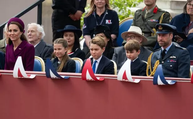 The children with their parents at the parade on Monday