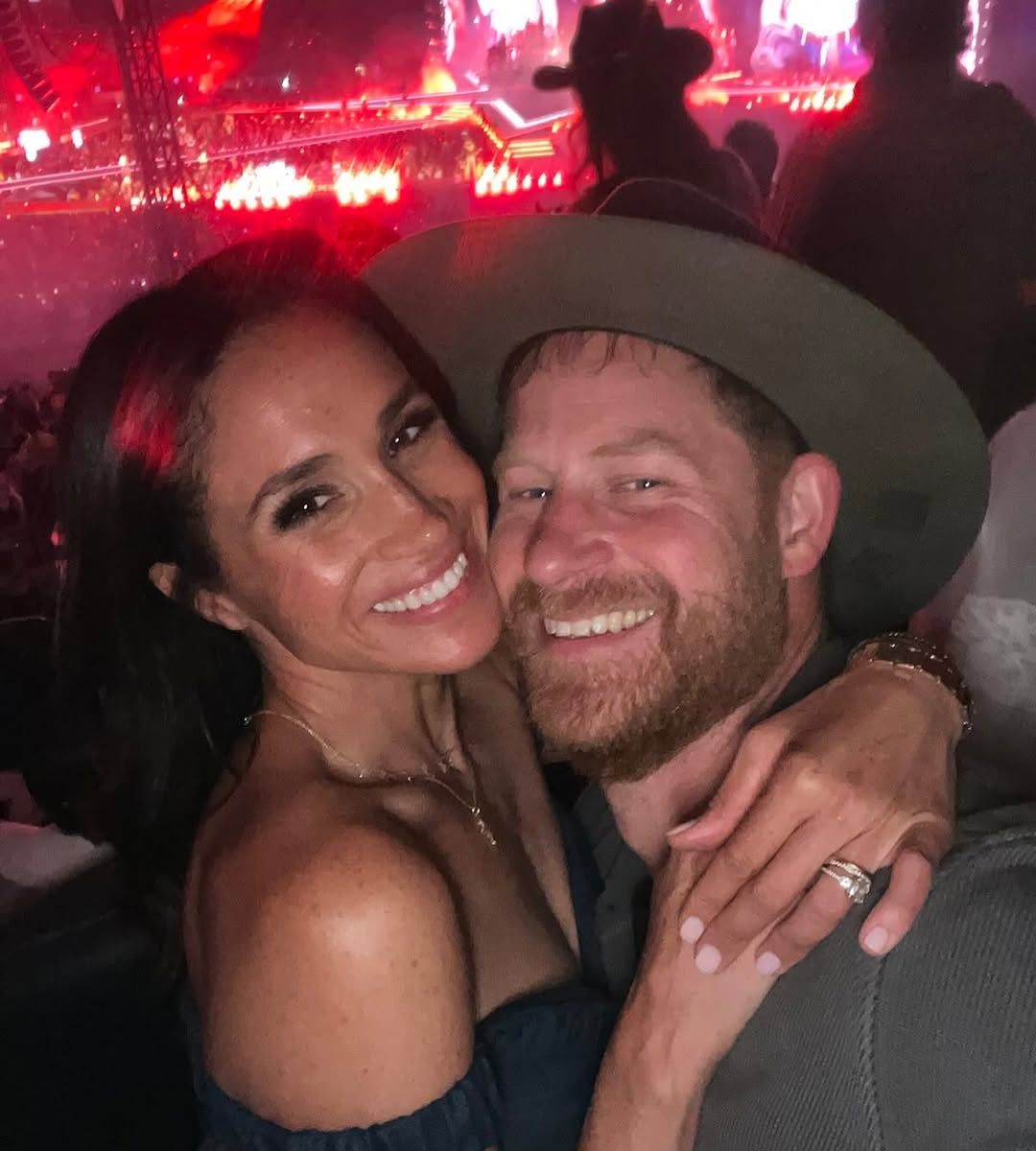 Image may contain Prince Harry Duke of Sussex Meghan Duchess of Sussex Person Photobombing Urban and Adult