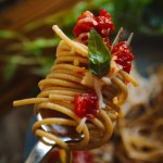 tomato pasta on a fork