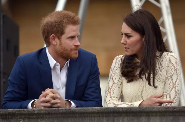 Prince Harry and Kate Middleton stood side-by-side, talking