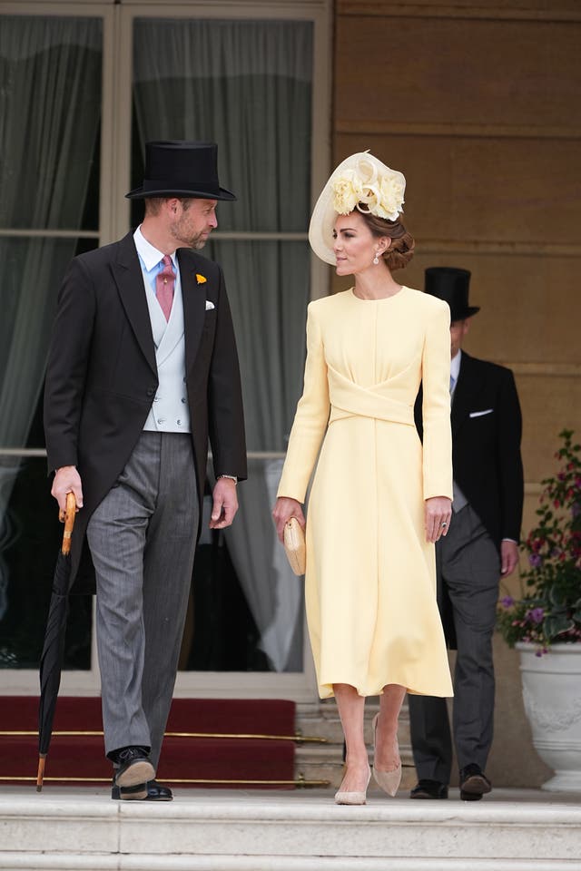 The Prince and Princess of Wales look at one another as they prepared to make their way onto the lawn 
