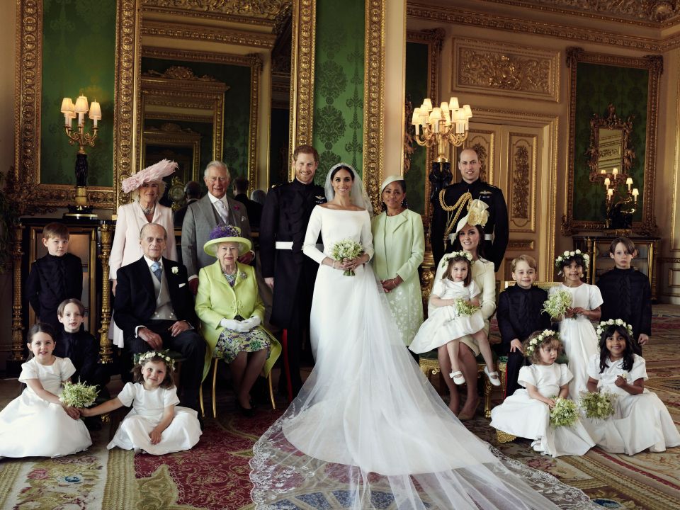 Formal wedding portrait of Prince Harry and Meghan Markle with family and wedding party at Windsor Castle.