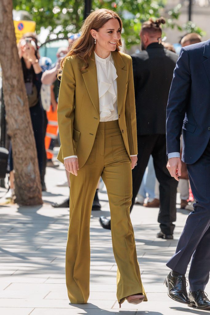 princess kate walking in green trouser suit 