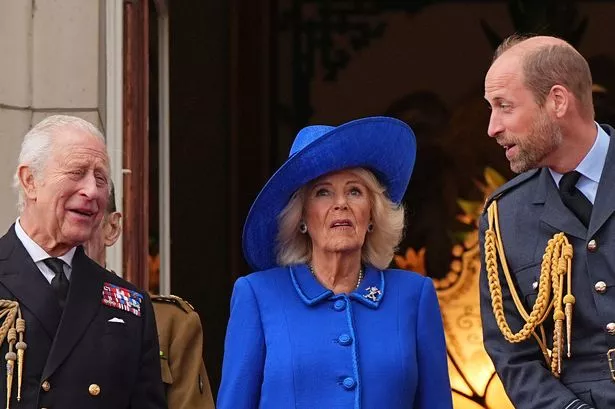 King Charles III and Queen Camilla and the Prince of Wales on the balcony of Buckingham Palace, London, to view the fly past featuring the Royal Air Force's Red Arrows and current and historic military aircraft, at the end of the military procession marking the 80th anniversary of VE Day, and in honour of those who served during the Second World War. 
