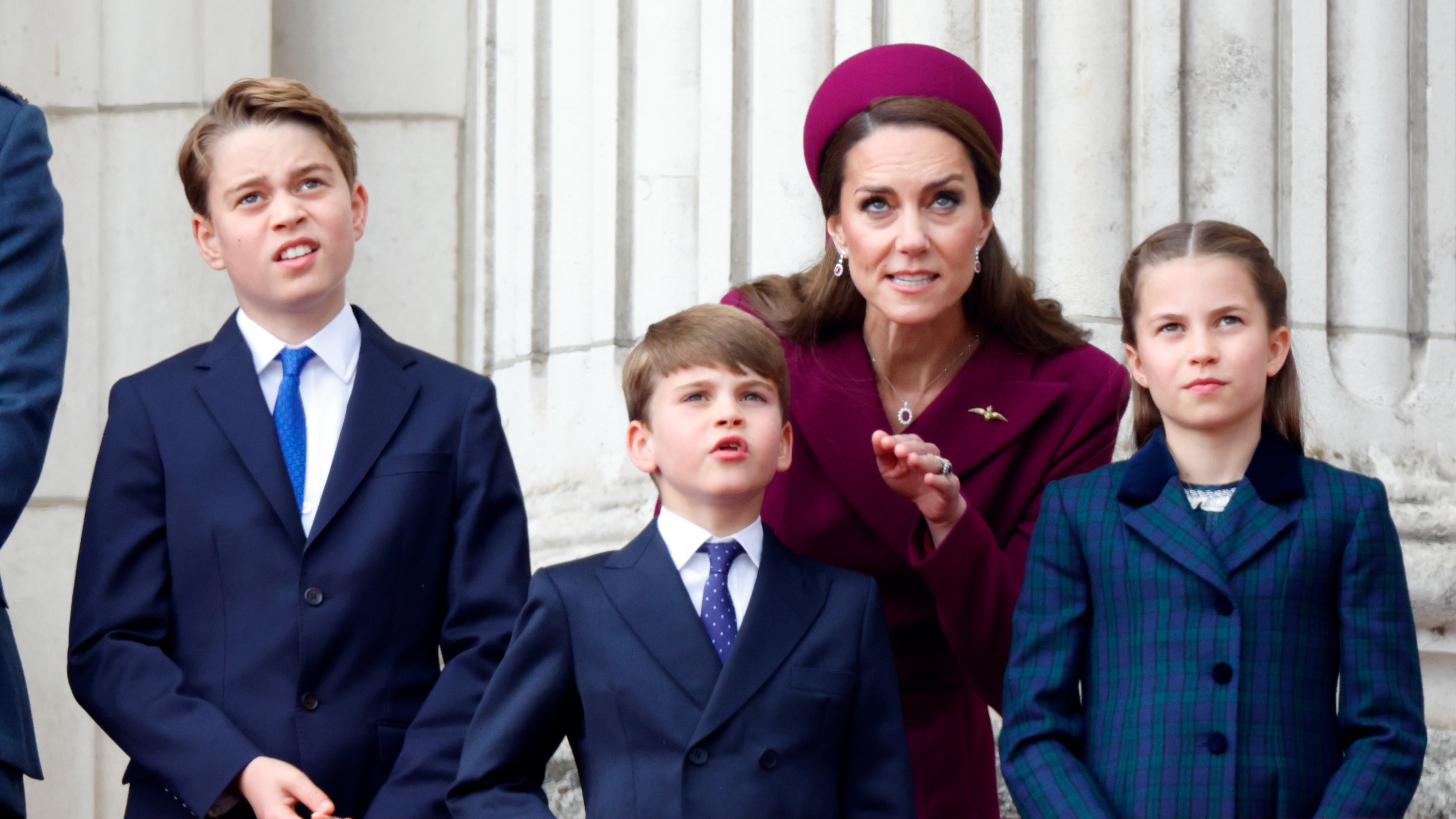 Prince George, Prince Louis, Catherine, Princess of Wales and Princess Charlotte of Wales watch a flypast from the balcony of Buckingham Palace to mark the 80th anniversary of VE Day on May 5, 2025