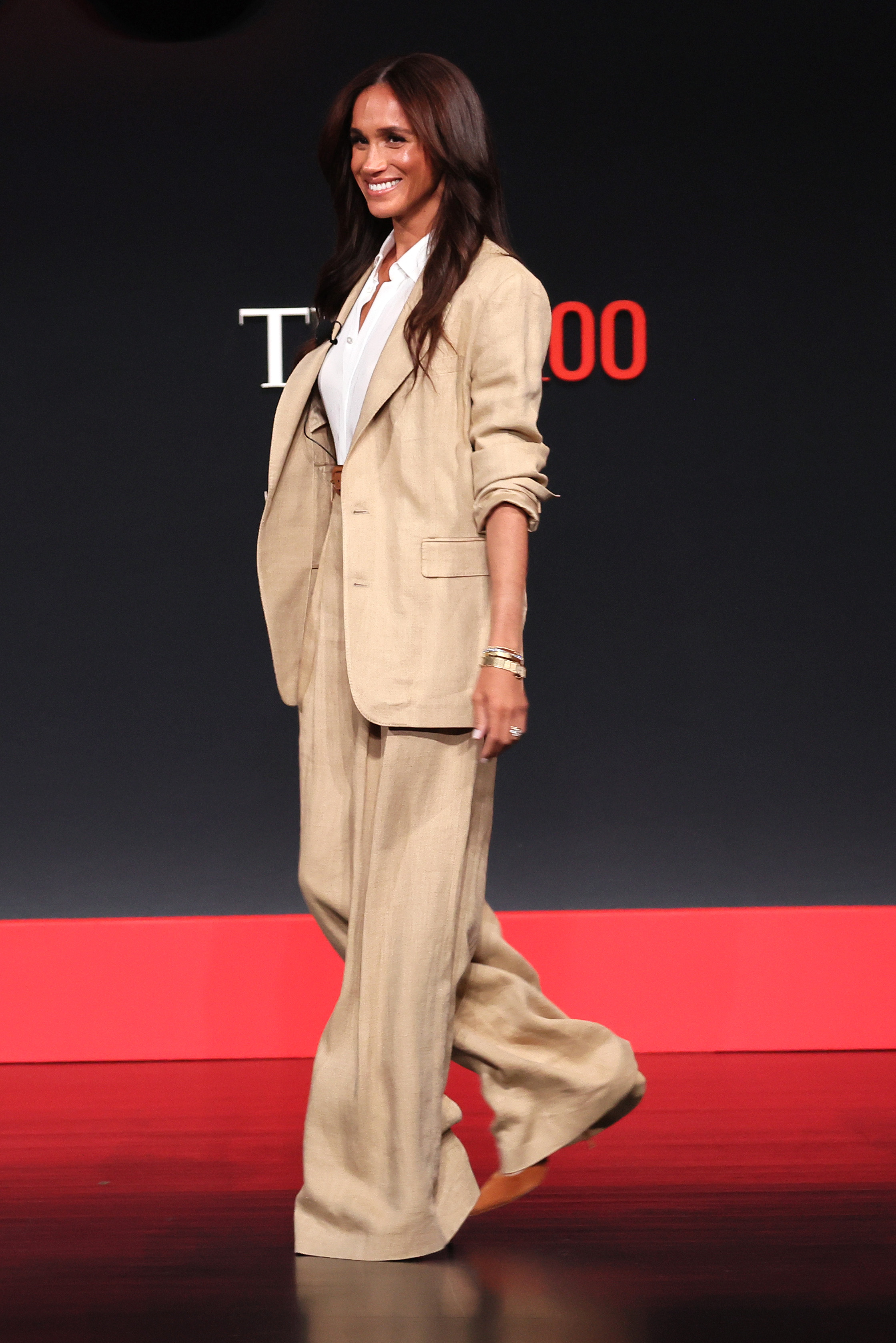 Meghan Markle wearing a tan suit at the Time100 event