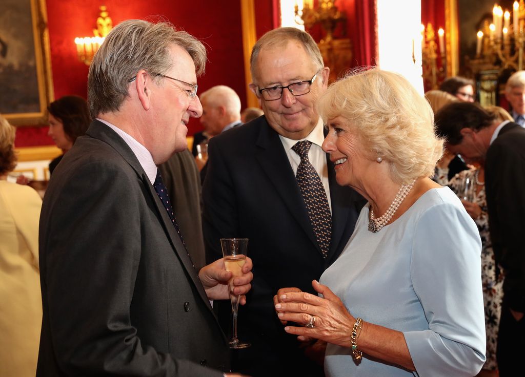 Camilla chats to Robert Hardman as she hosts the 30th Anniversary Garden Party for the National Osteoporosis Society in St James Palace on July 12, 2016 in London