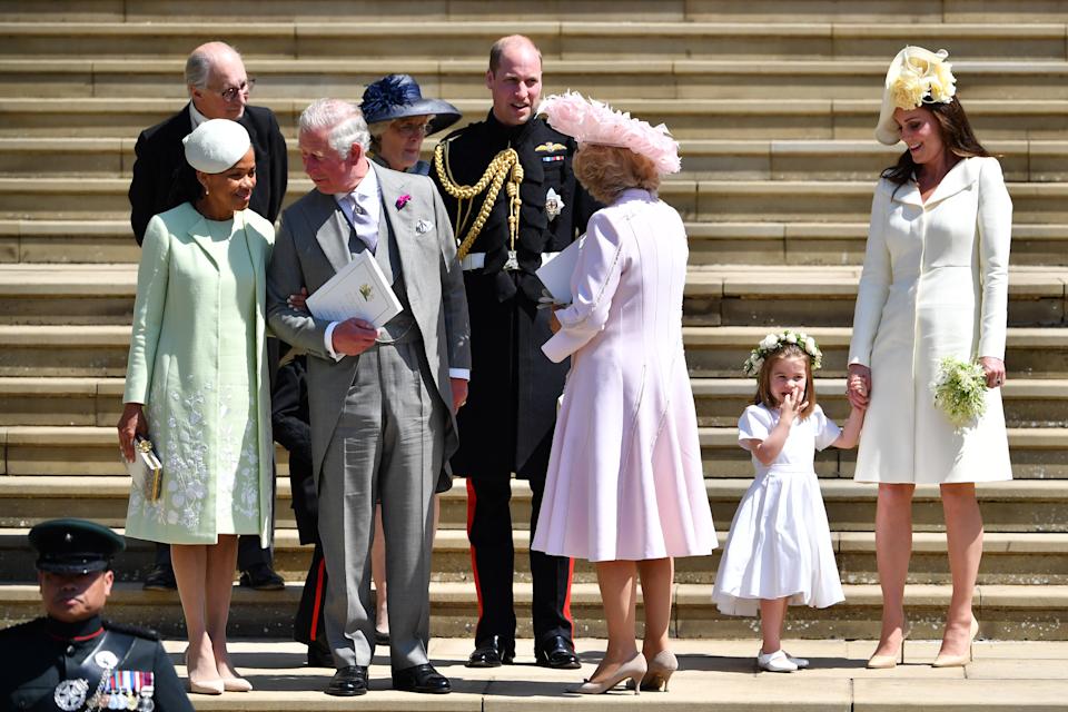 Doria Ragland talking to King Charles after Harry and Meghan's wedding, surrounded by Prince William, Princess Kate, Queen Camilla and Princess Charlotte