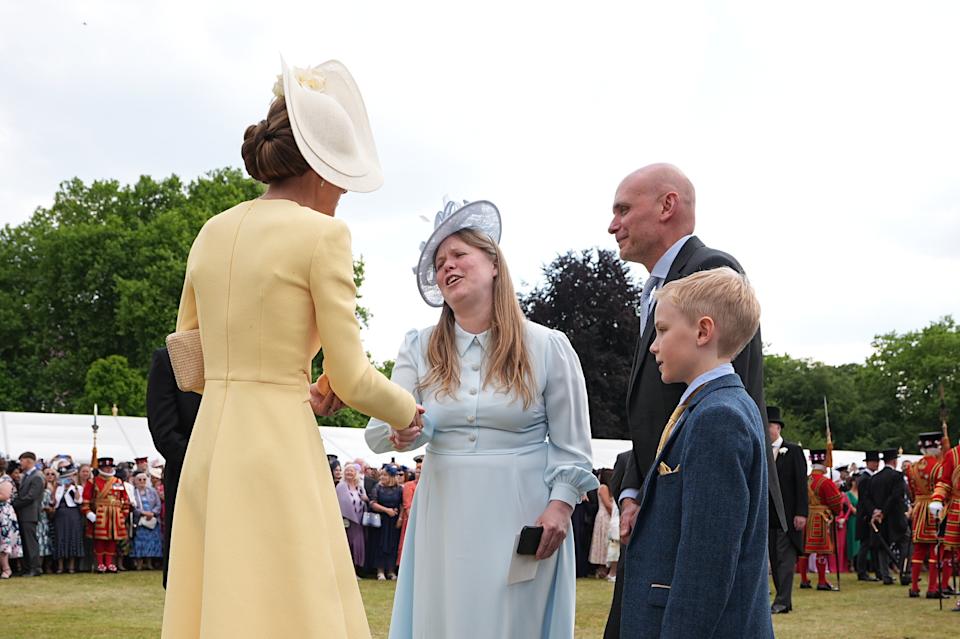Kate Middleton shaking hands with Liz Hatton's mother, Vicky, at a garden party