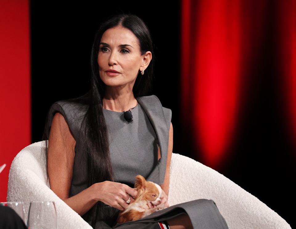 Demi Moore seated on stage