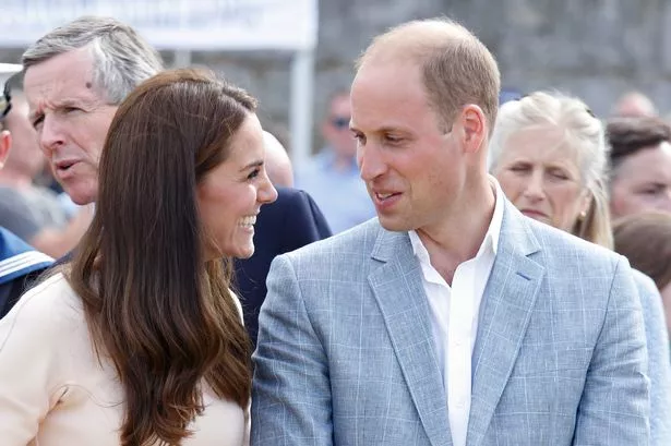 Prince William and Kate Middleton looking at each other and smiling
