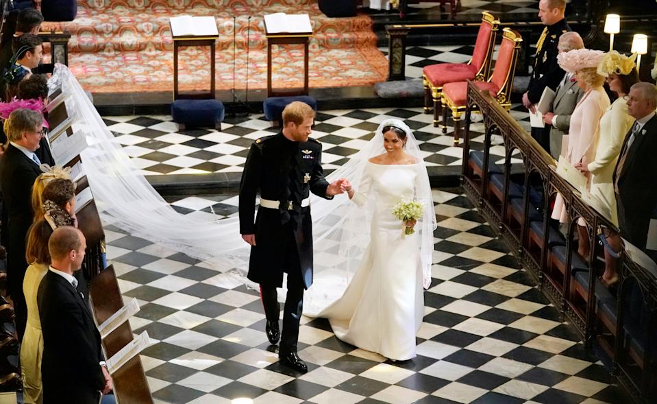 Meghan Markle walking down the aisle with Prince Harry on their wedding day