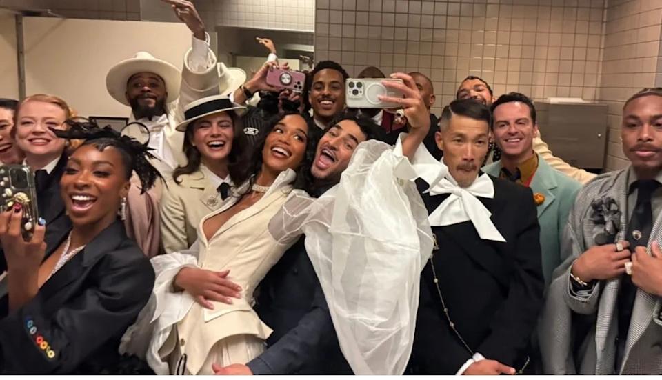 Group photo of well-dressed individuals taking a selfie at the 2025 Met Gala