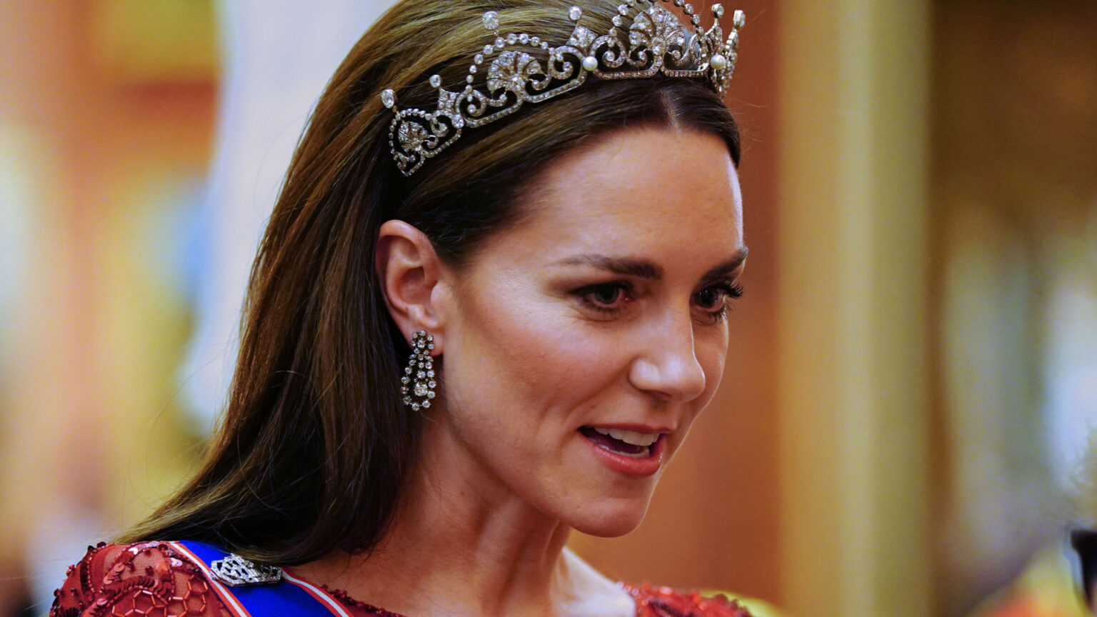 Kate Middleton wearing a tiara and a red gown