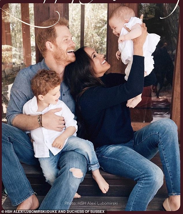 An old Christmas card with Prince Harry and Meghan Markle holding Archie and Lilibet