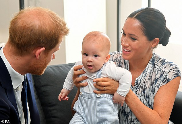 The Duke and Duchess of Sussex play with their son Archie during a meeting with Archbishop Desmond Tutu on August 23, 2022