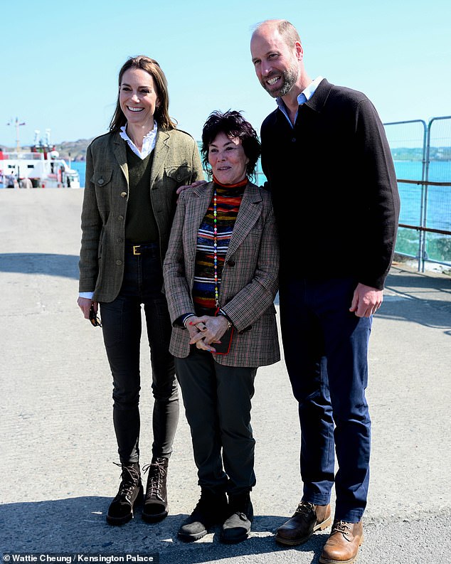 The Prince and Princess of Wale s had a surprise encounter with a comedy legend on their wedding anniversary trip. Ruby Wax , 72, spotted the royals on the Isle of Iona, in Scotland, after they had travelled there to meet the local community and learn about their way of life. Pictured: The Duke and Duchess of Rothesay pose for a picture with Ruby Wax