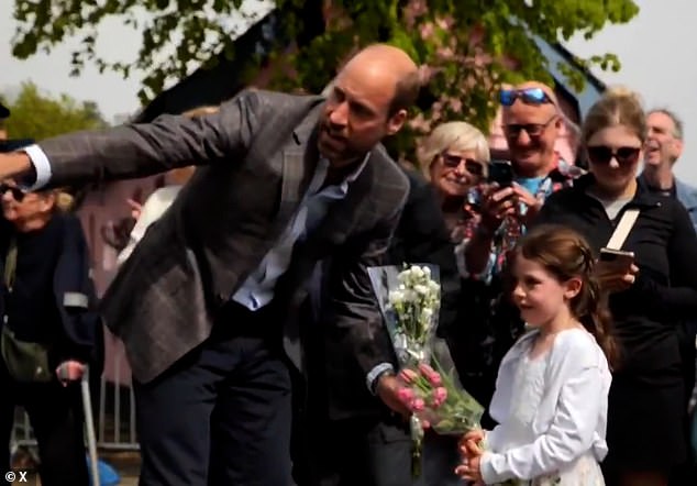 This is the adorable moment Prince William helped a little girl give some flowers to Kate during their visit to the Isle of Mull this week