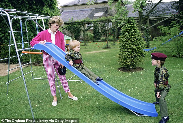 Prince William (right) and Prince Harry playing in the garden at Highgrove with their mother Princess Diana, dressed in miniature Parachute Regiment uniforms