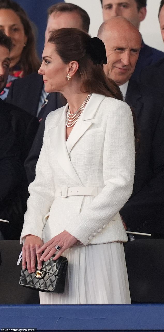 Kate paired her sophisticated ensemble with pointed nude heels, a stacked pearl necklace to match her earrings and a Chanel black crossbody bag with gold metal detailing