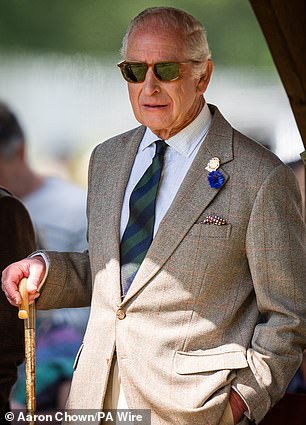 Charles looked typically stylish in his classic sunglasses with tortoiseshell frames