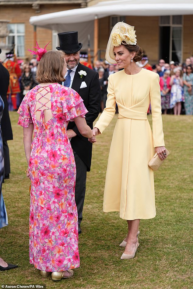 She was wearing her lemon yellow ensemble, worn previously to the Platinum Jubilee celebrations in 2022