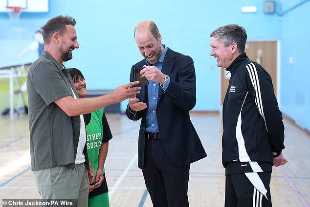 The Prince of Wales was shown something on an iPhone, and was greatly amused