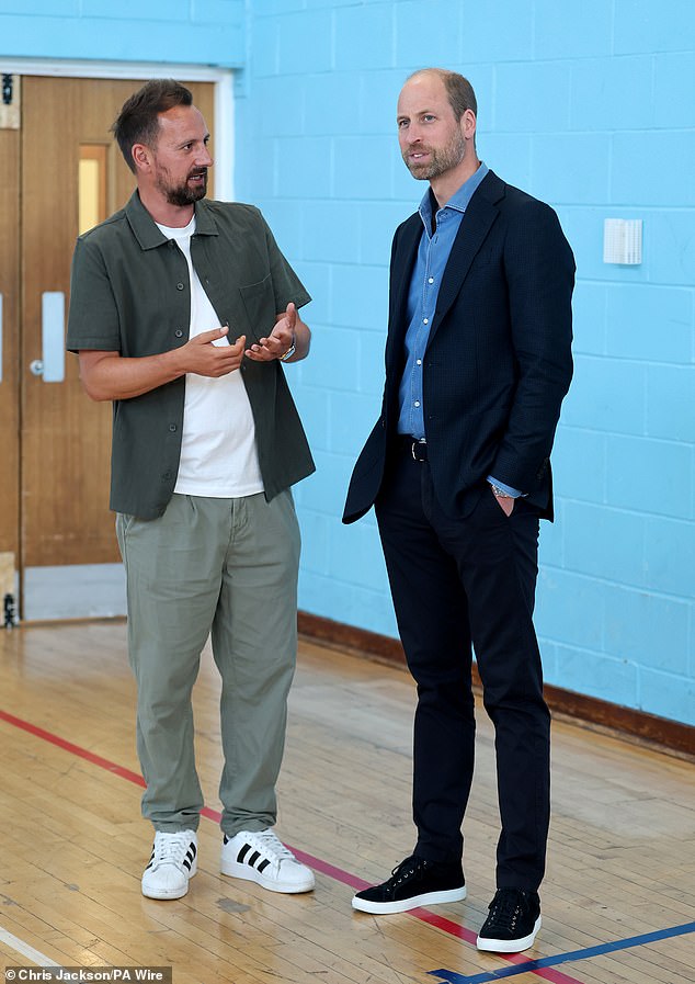 The Prince of Wales (right), known as the Duke of Rothesay when in Scotland, speaks with Street Soccer Scotland founder and CEO, David Duke
