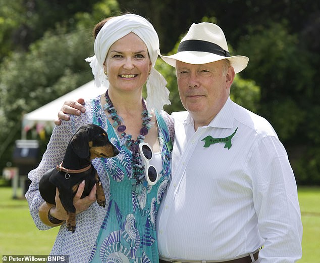 Lord Julian Fellowes is urging the royal estate to spare the 'sacred land' which is next to the Victorian novelist Thomas Hardy's historic home. Pictured: Lord and Lady Fellowes